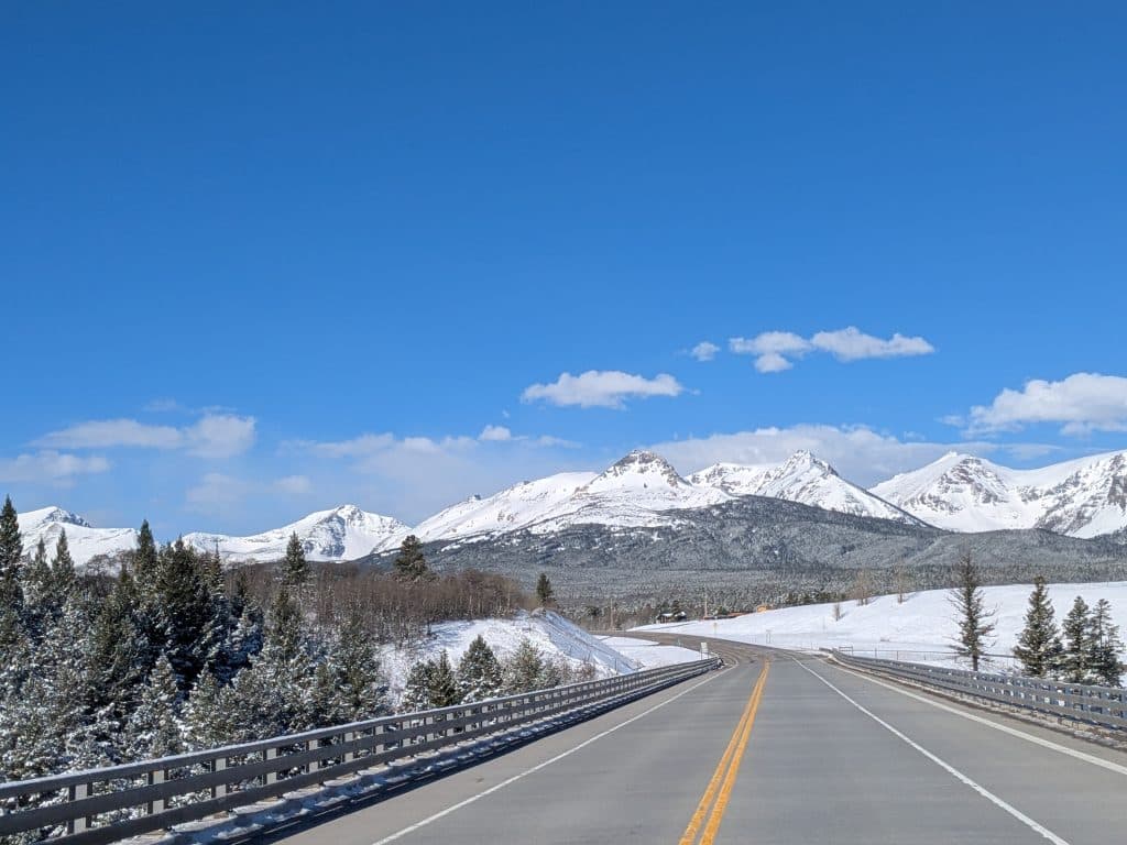 Snowy Mountain Road Blue Sky Snowy mountain road with clear blue sky. Winter landscape.